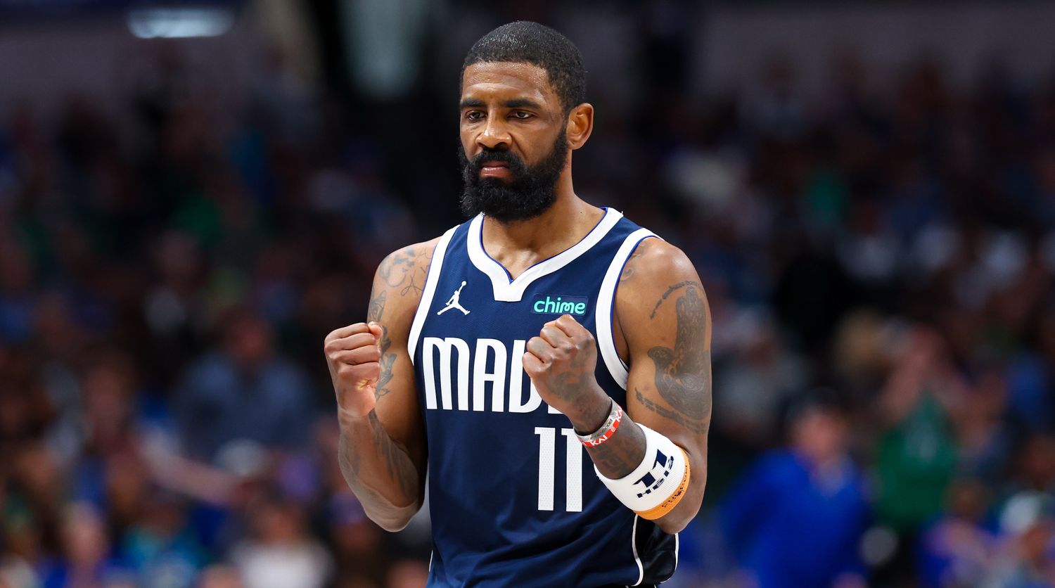 Dallas Mavericks guard Kyrie Irving clenches his fists.